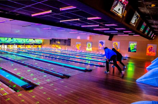 This is a picture of 2 people playing at bowling on Paris.