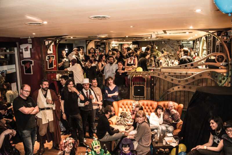 This is a picture of the interior of le dernier bar avant la fin du monde, which is a nice place to play and have a drink in Paris. This place is really crowded.