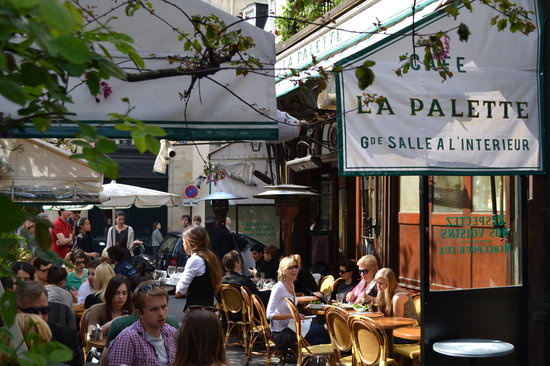 People are enjoying a romantic terrace in Paris, called la Palette